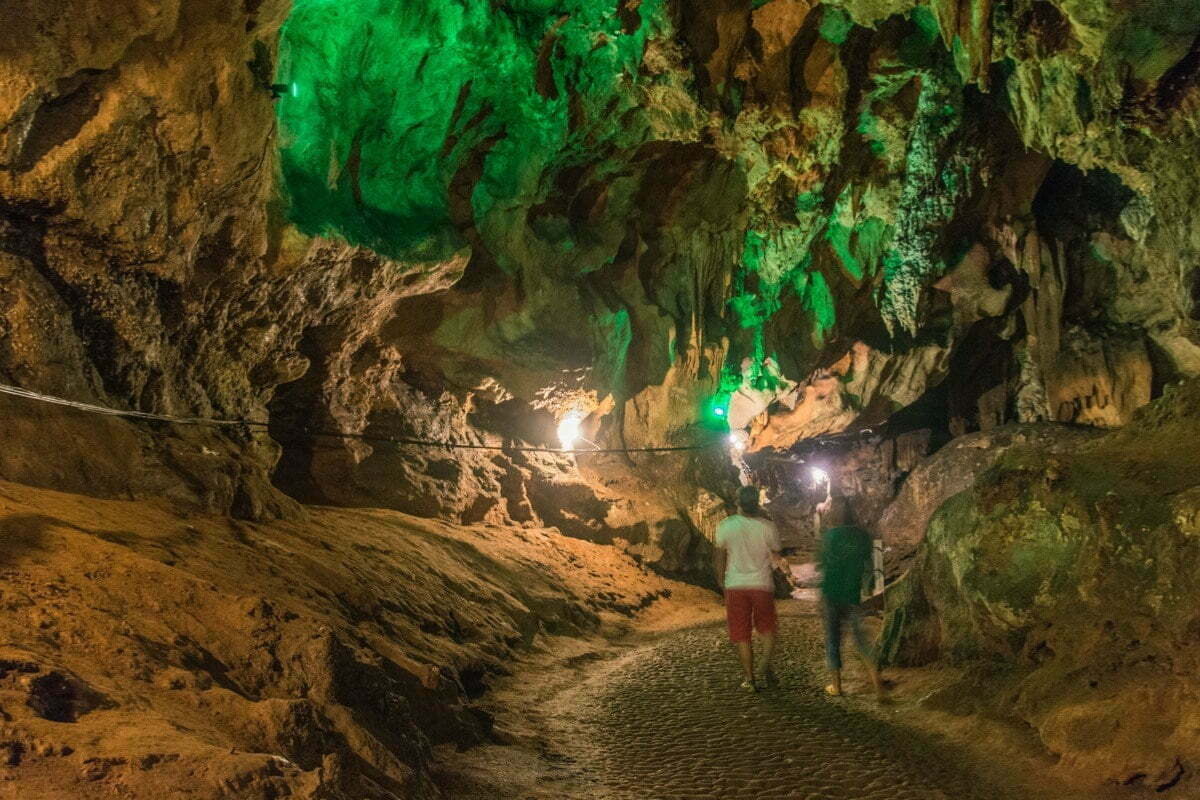Stalactites and stalagmites inside Chiang Dao Cave with illuminated chambers